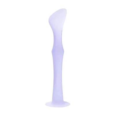 Ola Baby Diaper Rash Cream Applicator in lilac, featuring a suction base and a smooth, curved design for easy use.