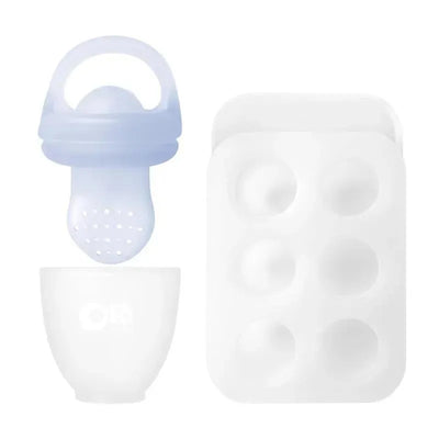 Silicone fruit feeder in light blue, a white cup, and a six-cavity popsicle mold for introducing solid foods.