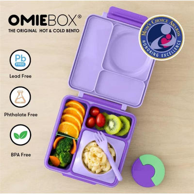 Insulated OMIEBox bento lunch box in lilac purple, featuring compartments with fruits, vegetables, and pasta.