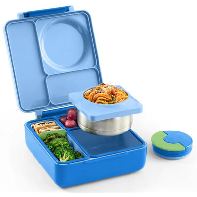 Insulated sea blue OMIEBox Bento lunch box opened, featuring compartments with pasta, broccoli, grapes, and a green lid.