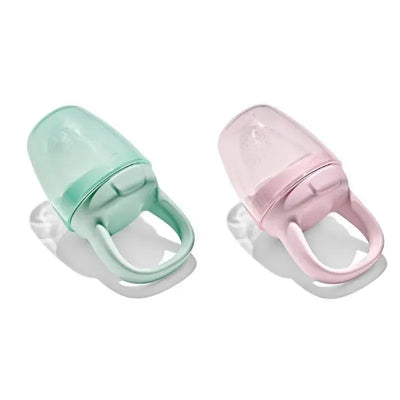 Oxo 2Pk Tot Silicone Self-Feeders in opal green and blossom pink, featuring secure grip handles and soft silicone design.