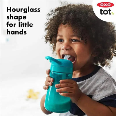 Oxo - Tot Adventure Water Bottle in Opal, held by a smiling child, features an hourglass shape designed for small hands.