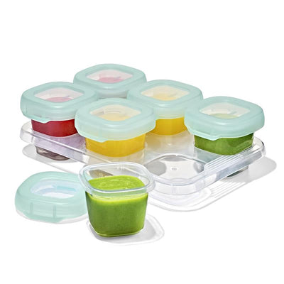 Oxo Tot Baby Blocks food storage containers, set of six 2 oz jars in various colors, with one jar in focus.