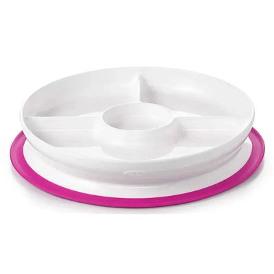 Oxo Tot Stick & Stay Divided Plate in pink, featuring three sections plus a central cup holder for easy mealtime organization.