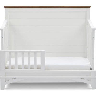 Parker House Artisan Crib with a white finish and a wooden top rail, designed for toddlers with a removable rail.
