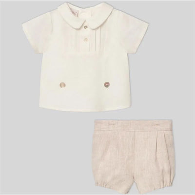 Cream woven newborn shirt with a collar and button details, paired with matching beige shorts.