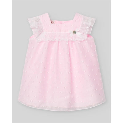 Woven newborn dress in chalk pink with lace detailing and a flower button, designed for baby girls.