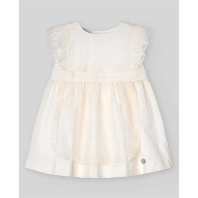 Cream-colored woven newborn dress with ruffled sleeves, bow detail, and lace trim, designed for baby girls.