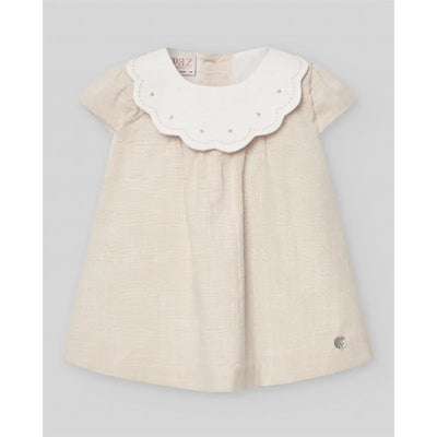 Woven linen dress for newborn girls featuring a scalloped white collar and decorative pearls.