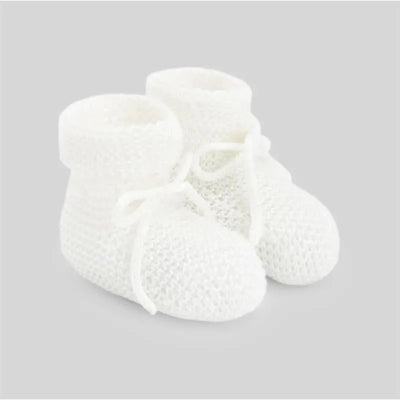 Knit newborn booties in soft white with a textured pattern and ties, designed for infant comfort.