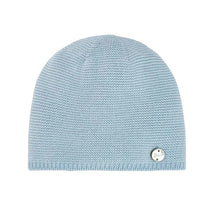 Sky blue knit newborn hat by Paz Rodriguez, featuring a small logo tag attached to the side.