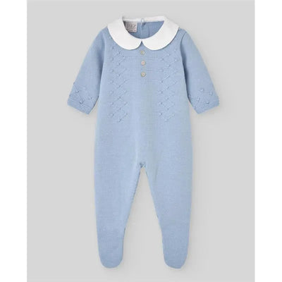Baby knit romper in chalk blue with a white collar and button details, designed for newborns.