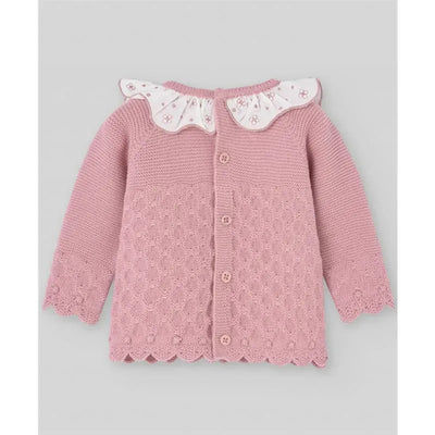 Baby knit newborn sweater in makeup pink with floral collar and decorative buttons. Features textured pattern and scalloped edges.