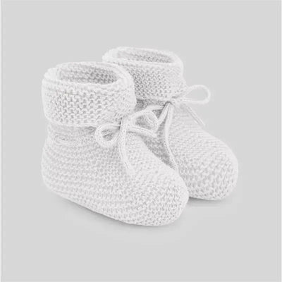 Neutral white knitted baby booties with tied laces, designed for infants, showcasing a soft and cozy texture.