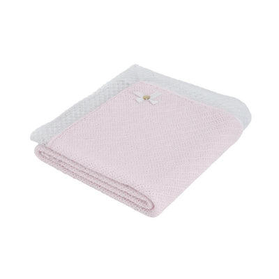 Paz Rodriguez Alaia blanket in chalk pink and white, featuring a textured design and a small bow detail.
