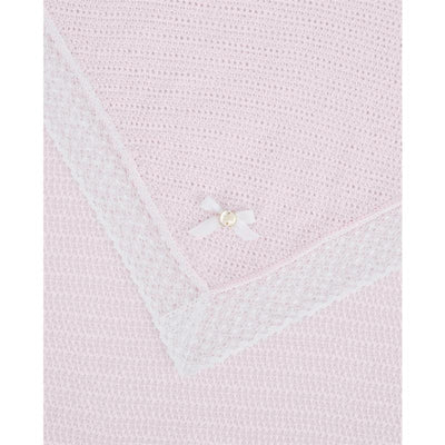 Paz Rodriguez Alaia blanket in chalk pink and white, featuring a textured design and a decorative white bow with a pearl.