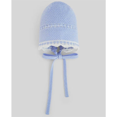 Knit newborn bonnet in light blue with cream scalloped lace trim and ties, designed for infants.