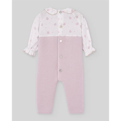 Knit newborn romper in mauve with a patterned top and button closure, featuring frilled sleeves and delicate details.