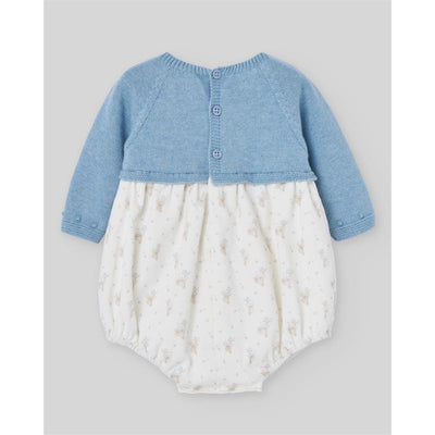 Knit newborn romper in Dutch blue, featuring a buttoned top with floral patterned bottom.