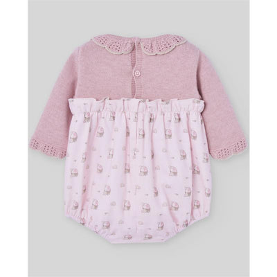 Newborn knit romper in powder pink and light brown with a knitted top and printed floral bottom.
