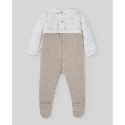 Knit newborn romper in light brown, featuring a white top with subtle pony print and button detail.