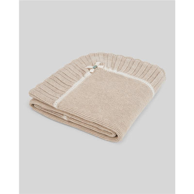 Knit newborn shawl in light brown and cream, featuring a textured design and decorative ribbon detail.