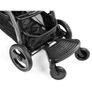 Peg Ride With Me Board mounted on a stroller, featuring a textured footboard and swivel wheels for added mobility.