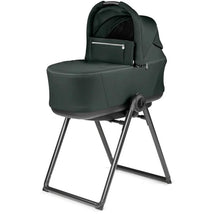 Peg Pop Up Bassinet Stand for City Loop, featuring a dark green fabric seat and a sturdy black frame.