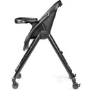 High chair from Peg Living in True Black, featuring a sleek design, adjustable tray, and smooth-rolling wheels.