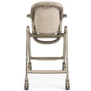 Folding high chair and recliner in Space Sand color, featuring a cushioned seat, adjustable height, and wheels for mobility.