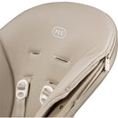 High chair seat detail of the Peg-Perego Living Grow with Baby, featuring beige padding and safety straps.