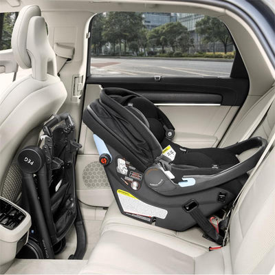 Baseless infant car seat in True Black, securely installed in the back seat of a vehicle, highlighting safety features.