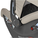 Peg Primo Viaggio Nido Infant Car Seat in Astral color, featuring safety harness, mesh panel, and detailed instructional labels.