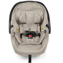 Peg Primo Viaggio Nido Infant Car Seat in Astral color, featuring soft fabric, harness system, and safety warning labels.