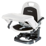 Booster chair featuring a white frame, black seat pad, and removable tray, designed for safely elevating children during meals.