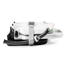 Peg Rialto Booster High Chair in Licorice, featuring a compact folded design with a safety strap and tray.