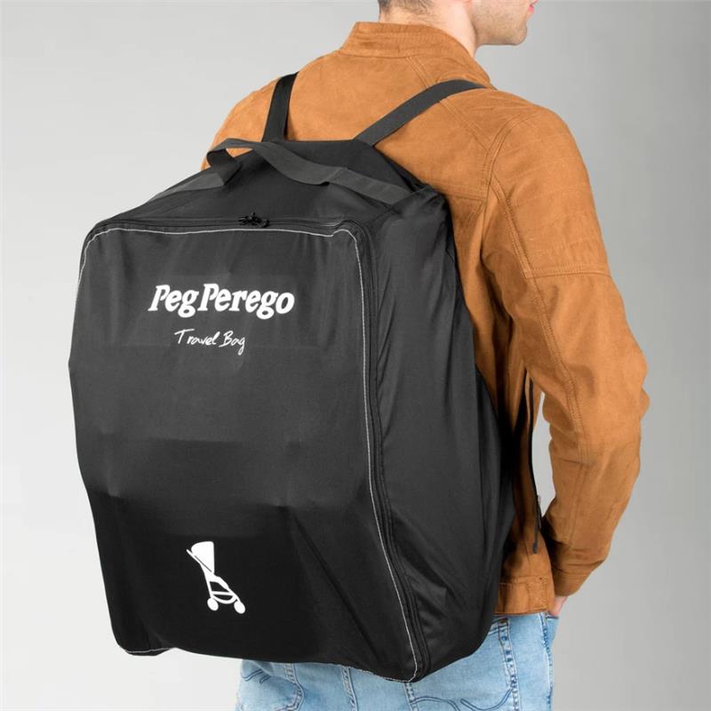 Black Peg Perego travel bag being worn on the back of a person, showcasing its brand name and stroller icon.