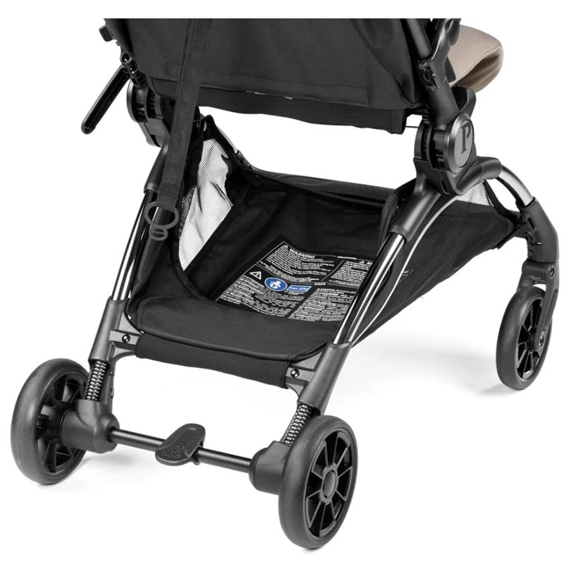 Compact Peg Volo stroller in Misty Beige with a storage basket and detailed product information label visible.