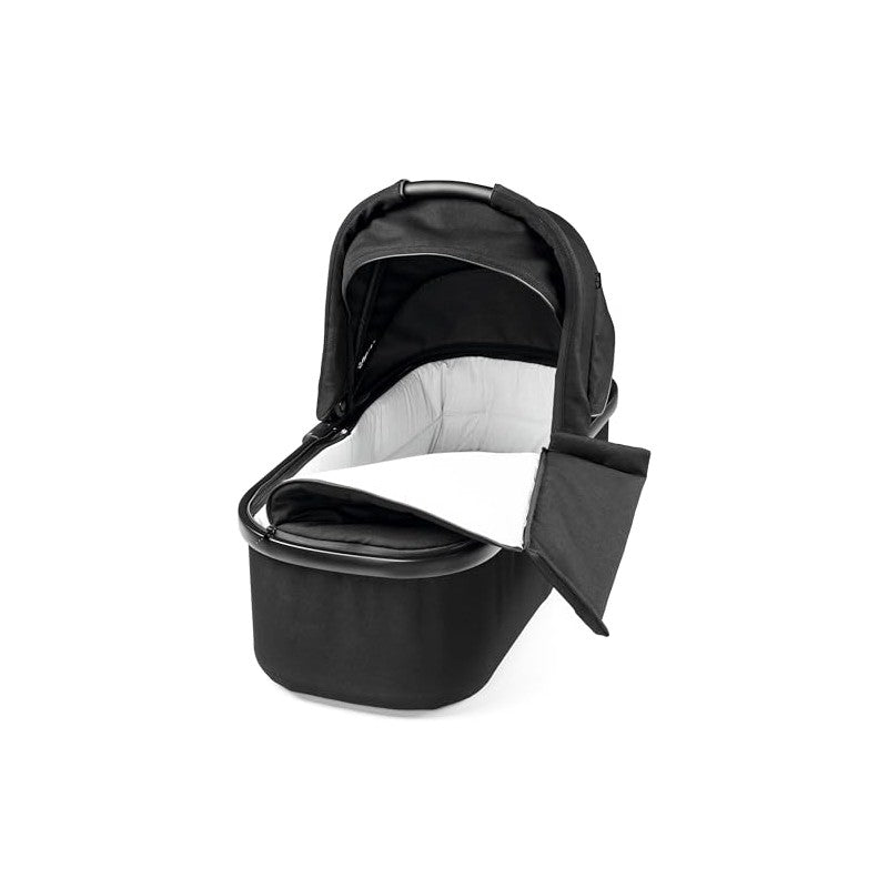 Ypsi Bassinet with Stand by Me in True Black features a sleek design with a soft, padded interior and a removable canopy.