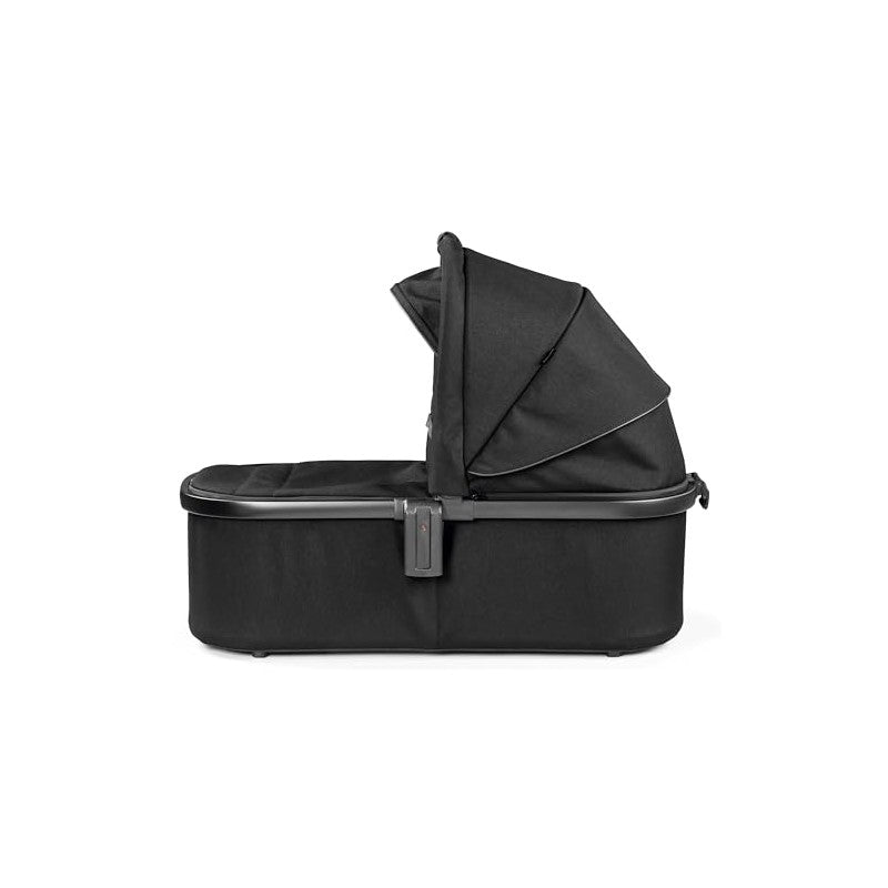 Peg Perego Ypsi Bassinet in True Black, featuring a retractable canopy and sturdy base for infant comfort and safety.