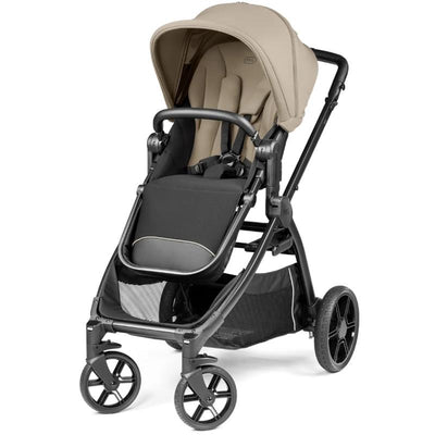 Compact Peg Perego Ypsi stroller in Vanilla Blend with a black and cream design, featuring a canopy and adjustable seat.