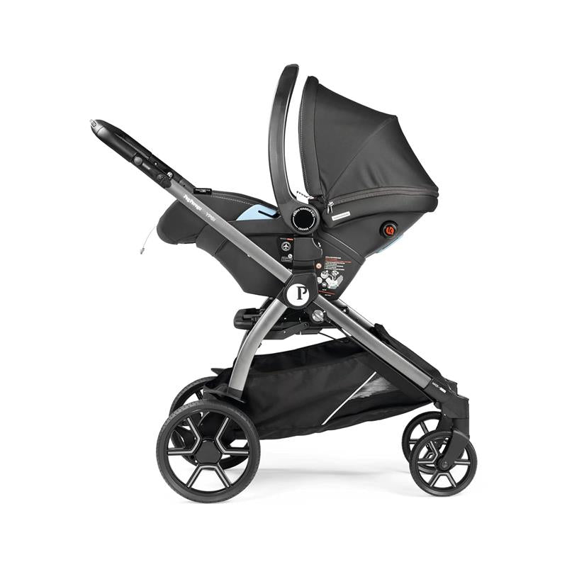 Peg Perego Ypsi Travel System in metal with a sleek black design, featuring a reclining seat and a spacious storage basket.