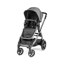 Ypsi Travel System in Vanilla Blend featuring a sleek black stroller with a spacious seat and adjustable canopy.