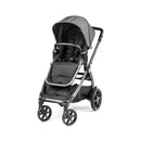 Ypsi Travel System in Vanilla Blend featuring a sleek black stroller with a spacious seat and adjustable canopy.