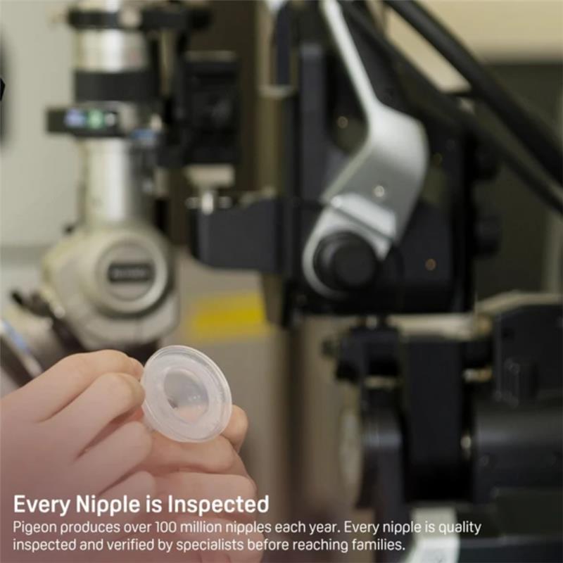 Silicone nipple held by a hand, with inspection equipment in the background, emphasizing quality control for Pigeon products.