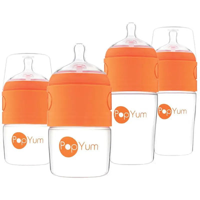 Four Pop Yum baby bottles in orange, featuring clear bodies and orange collars with the Pop Yum logo.