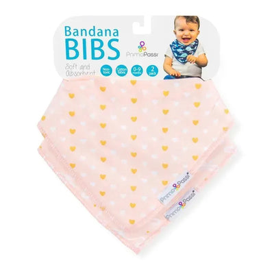 Two pink bandana bibs featuring gold hearts and white bows, labeled as Primo Passi, suitable for infants 0-9 months.