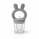 Silicone food feeder with a gray bunny-ear handle, designed for infants to safely eat solid foods.