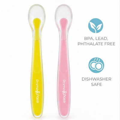 Set of four silicone spoons in pink and yellow by Primo Passi, labeled BPA, lead, and phthalate free, dishwasher safe.