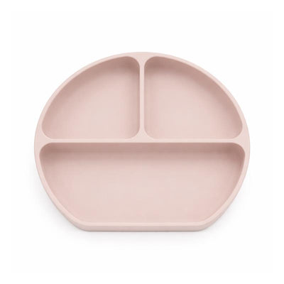 Silicone suction plate in rose pink with three compartments for serving meals to young children.